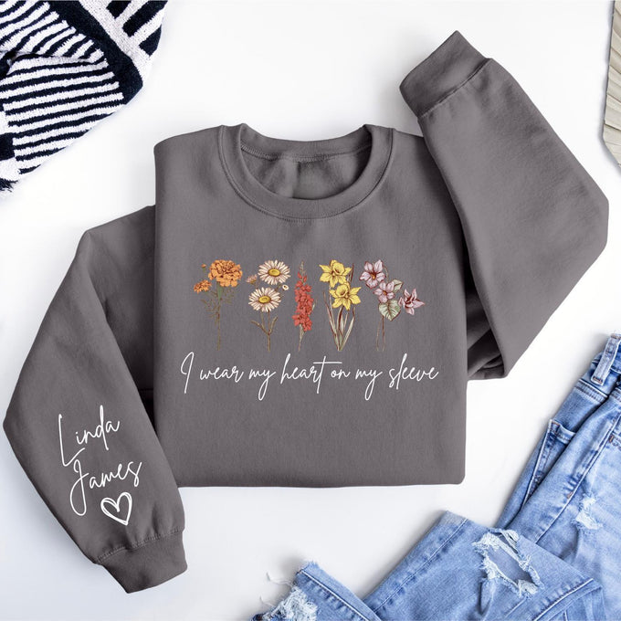 I Wear My Heart On My Sleeve Sweatshirt, Personalize Birth Month Flowers Mom Gift Sweatshirt, Christmas Gift For Mom, Mothers Day Gift
